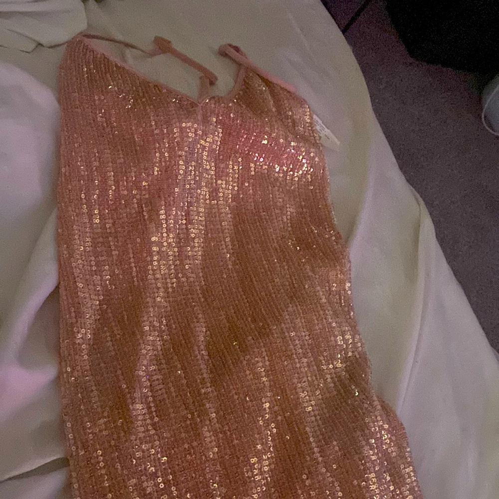 It’s a bright new dress rose gold, size s